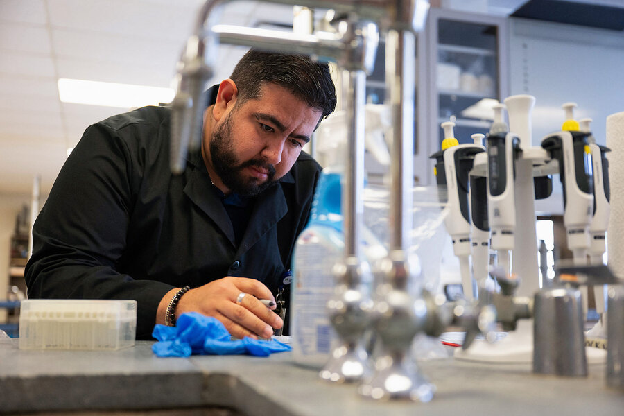 Christian Carrera, a visiting research specialist, processes a specimen as he works on a study under a federal grant from an agency that is part of the National Institutes of Health, at the University of Illinois College of Nursing in Chicago, Feb. 28, 2025. The Trump administration has frozen almost all funding and grant approvals by NIH.