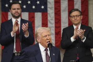 Donald Trump speaks as Vice President JD Vance and House Speaker Mike Johnson stand behind him, clapping.