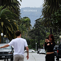 A person is recorded with the Hollywood sign in the background in May, after President Donald Trump announced a 100% tariff on films made outside of the U.S. Trump has not followed through on imposing the tariff, saying all options are on the table to "Make Hollywood Great Again."