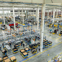 A view of Form Energy's factory floor shows battery equipment, supplies, and lanes for maneuvering.
