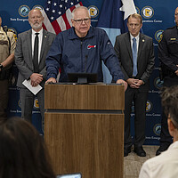 Minnesota Gov. Tim Walz speaks to reporters about what he called politically motivated violence.