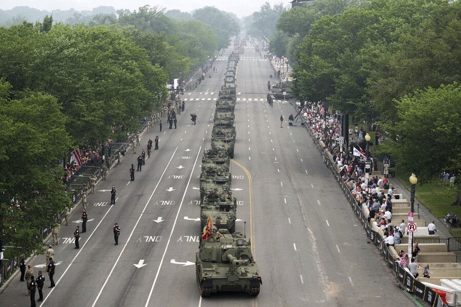 A military parade of green Army tanks rolls through Washington.