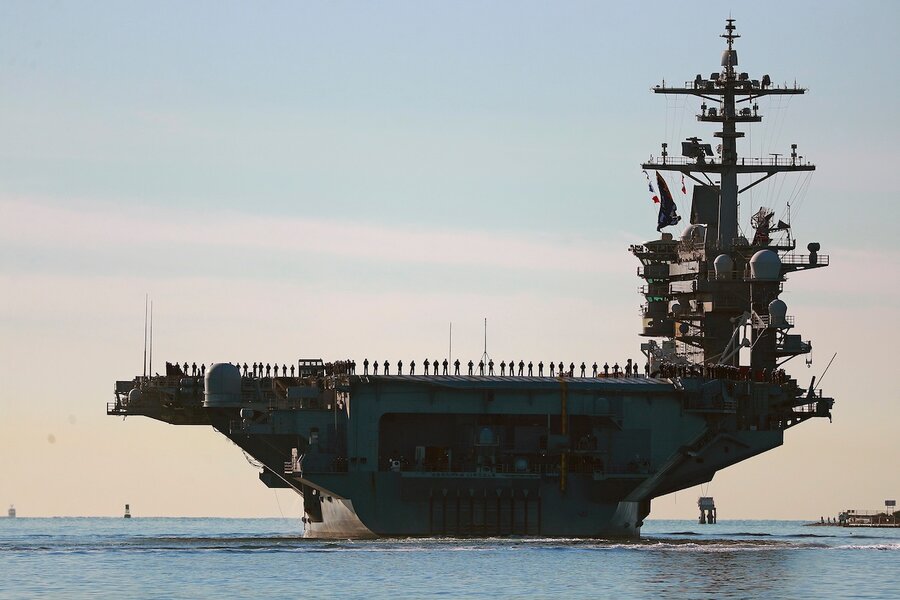 Top military commander visits long-deployed aircraft carrier