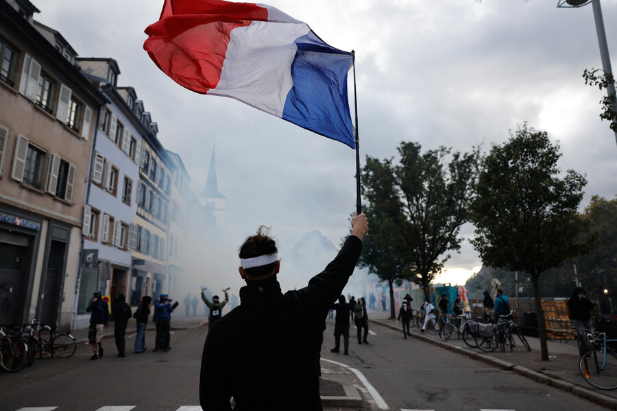 Police and protesters clash in Paris as demonstrations break out across Europe