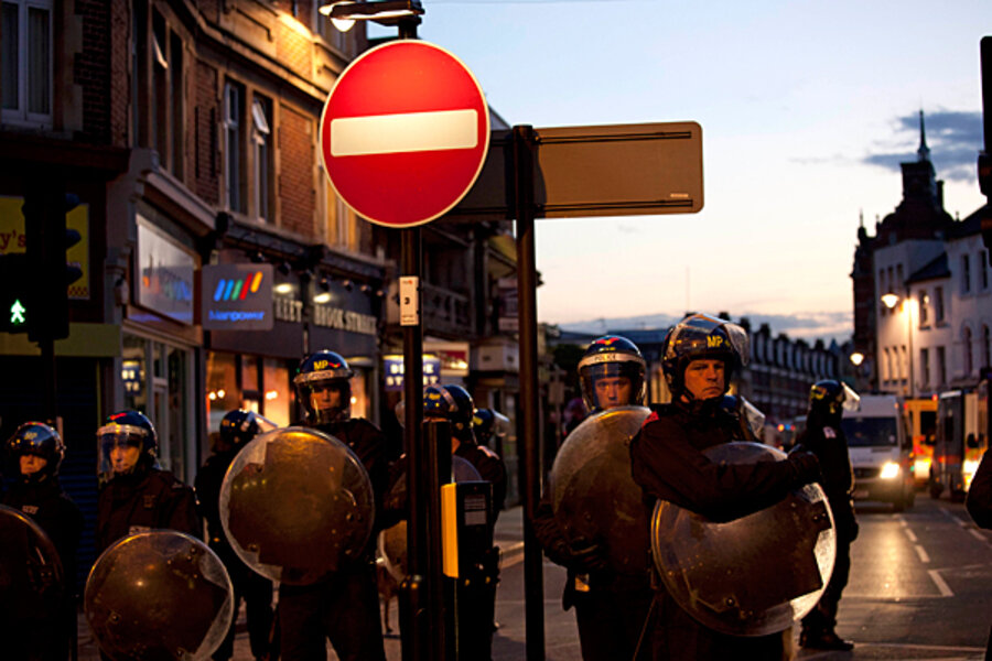 London riots strain police force. Have spending cuts played a role in